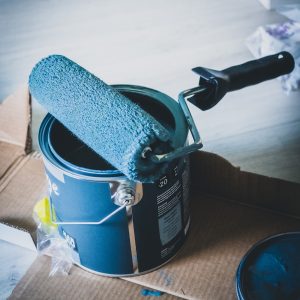 blue and white can on white table
